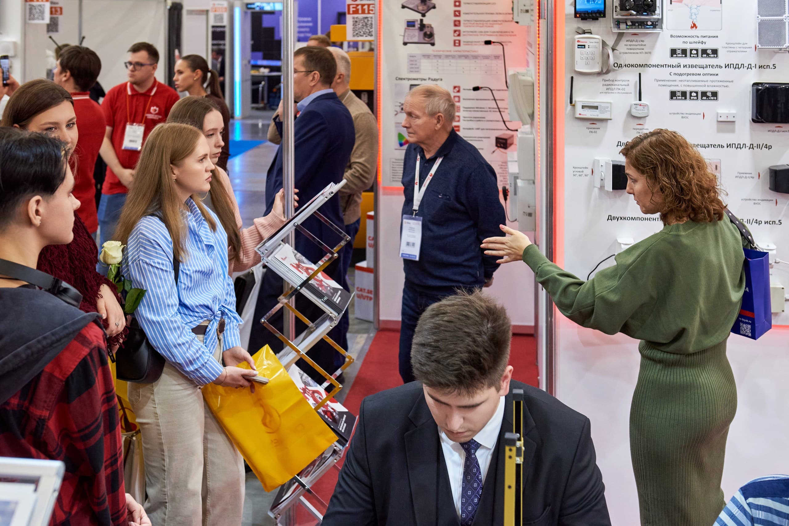 Visitors exploring fire detectors at an exhibitor’s stand at Sfitex.